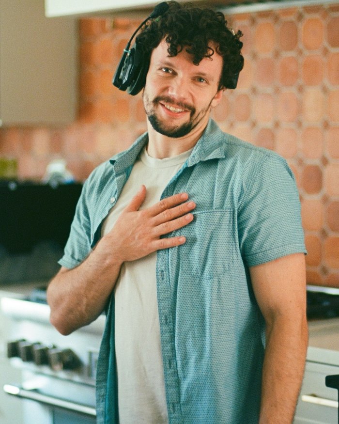 Rob Leeder on set, wearing production headphones